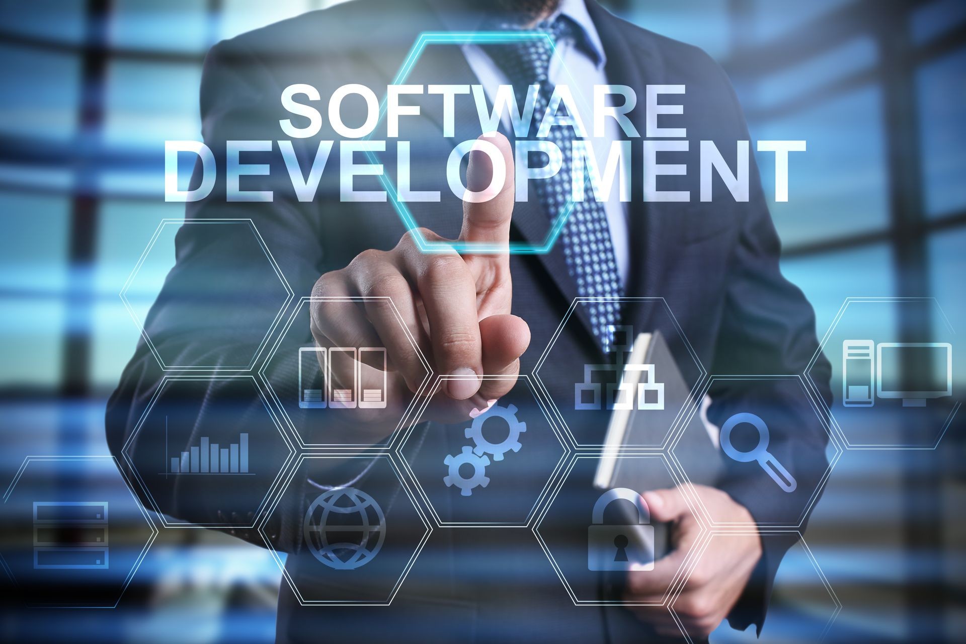 businessman using modern computer, pressing software development button on virtual screen. business strategy as concept